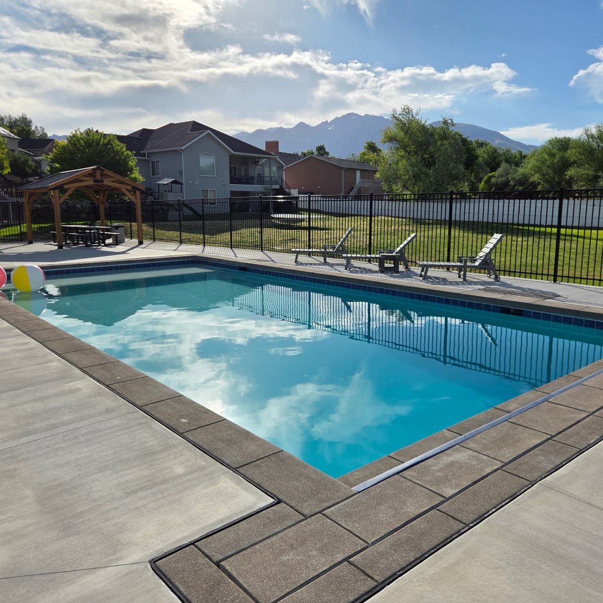 Freeform gunite pool at dusk